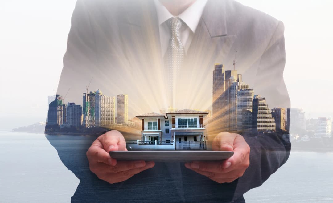 Business professional holding property model